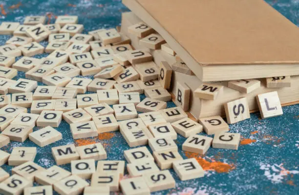 wooden dice with letters them pages book 612x400 1
